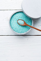 Image showing Salt in spoon at cup on white table