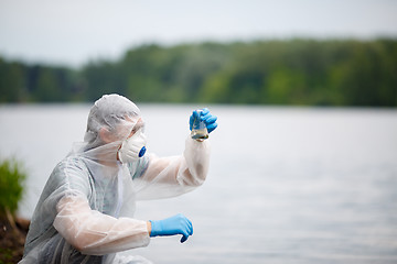 Image showing One ecologist with test tube