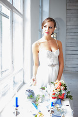 Image showing Beautiful bride in wedding dress, white background