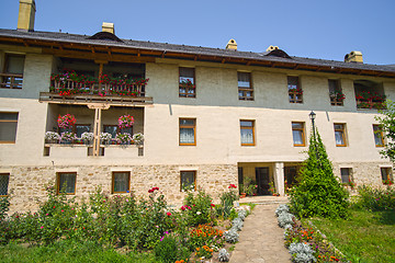 Image showing Flower garden and traditional monastery