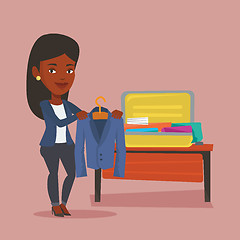 Image showing Woman packing her suitcase vector illustration.