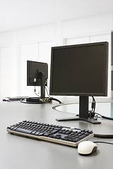 Image showing Two computers in an office