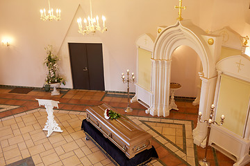 Image showing coffin with flowers and stand at funeral in church