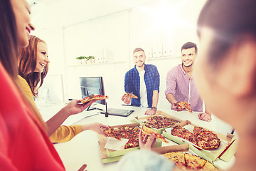 Image showing happy business team eating pizza in office