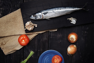 Image showing Mackerel and vegetables on a wooden table