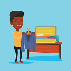 Image showing Man packing his suitcase vector illustration.