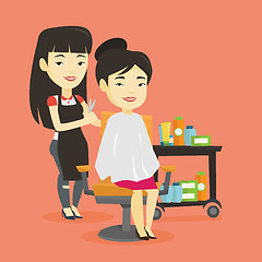 Image showing Hairdresser making haircut to young woman.