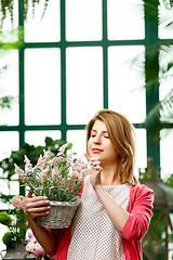 Image showing Happy florist at green house