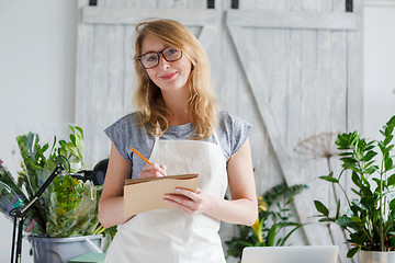 Image showing Portrait of young girl florist