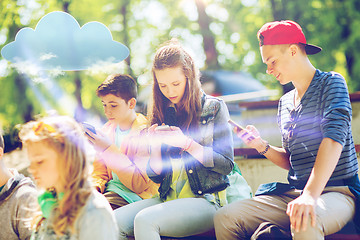 Image showing happy teenage friends with smartphones outdoors