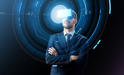 Image showing businessman in virtual reality headset over black