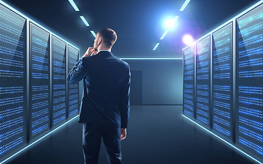 Image showing businessman over server room background