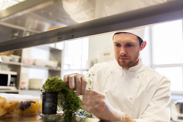 Image showing male chef working at restaurant kitchen