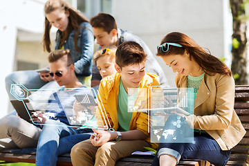 Image showing happy students or friends with tablet pc outdoors