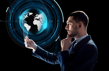 Image showing businessman with tablet pc and virtual globe