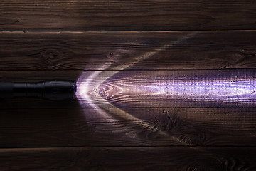 Image showing Wooden background with glowing lantern