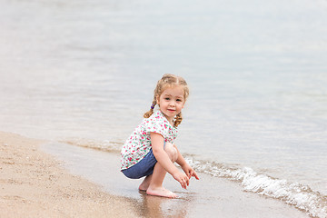 Image showing The girl on the sea beach.