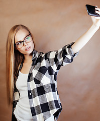 Image showing young happy smiling hipster blond girl with backpack ready to sc