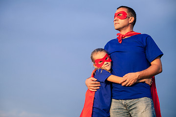 Image showing Father and daughter playing superhero at the day time.