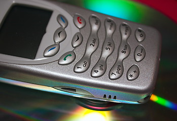 Image showing mobile phone on a disc