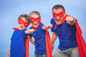 Image showing Father and children playing superhero at the day time.