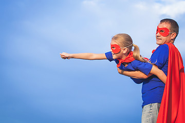 Image showing Father and daughter playing superhero at the day time.