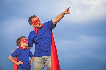 Image showing Father and son playing superhero at the day time.