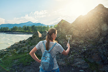 Image showing Woman taking selfie on mobile phone