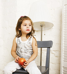 Image showing little cute brunette girl at home interior happy smiling close up, lifestyle real people concept