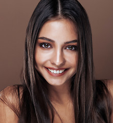 Image showing cute happy young indian woman in studio close up smiling, fashion mulatto, lifestyle people concept