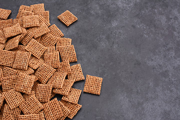 Image showing Malted shredded wheat biscuits breakfast cereal on grey slate ba