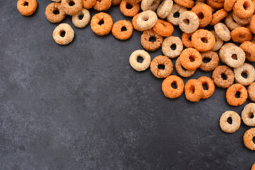 Image showing Multigrain hoops breakfast cereal diagonal border on grey slate