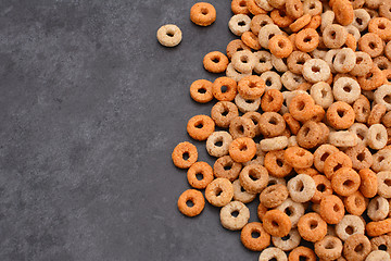 Image showing Multigrain hoops breakfast cereal on grey slate background