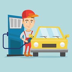 Image showing Worker filling up fuel into car at the gas station