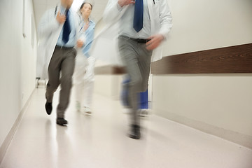 Image showing close up of medics or doctors running at hospital