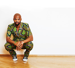 Image showing portrait of young handsome african man wearing bright green nati