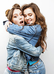Image showing best friends teenage girls together having fun, posing emotional on white background, besties happy smiling, lifestyle people concept close up. making selfie