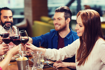 Image showing friends dining and drinking wine at restaurant