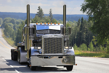 Image showing Silver Peterbilt 359 S Trucking on Scenic Highway