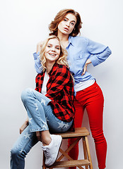 Image showing best friends teenage girls together having fun, posing emotional on white background, besties happy smiling, lifestyle people concept close up. making selfie