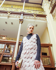 Image showing young attractive fashion lady on railway station waiting, vintag