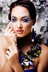 Image showing floral face art with anemone in jewelry, sensual young brunette 