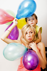 Image showing pretty real family with color balloons on white background, blon