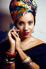 Image showing beauty bright african woman with creative make up, shawl on head