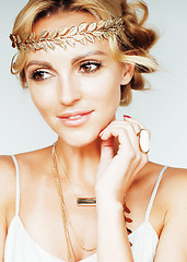 Image showing young blond woman dressed like ancient greek godess, gold jewelr