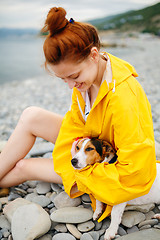 Image showing Girl with dog on beach