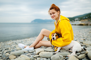 Image showing Girl with dog on beach