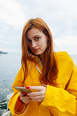 Image showing Redhead woman posing on ocean