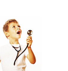 Image showing little cute boy with stethoscope playing like adult profession d