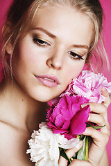 Image showing young beauty woman with flower peony pink closeup makeup soft te